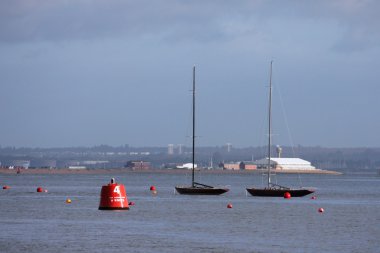 Moored yachts on the solent clipart