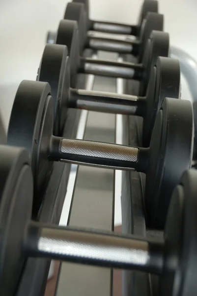 stock image Close up on gym workout dumb bells