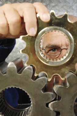 Phycisist examining gears clipart