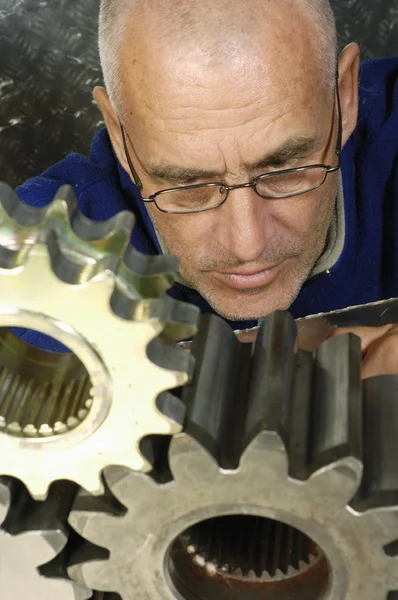 Engineer and machine parts — Stock Photo, Image