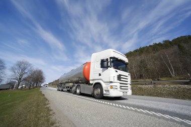 Large fuel-truck on the move clipart