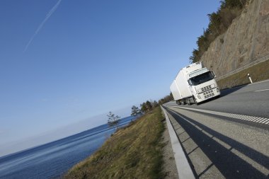 Truck on scenic highway clipart