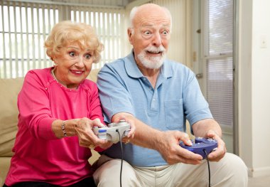 Senior Couple Play Video Games clipart