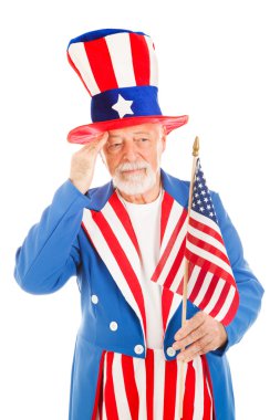 sam Amca'nın Amerika bayrağını selamlıyor