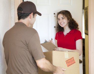 Young Woman Signs for Delivery clipart