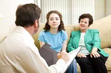 Teen and Mom Meet Psychologist clipart