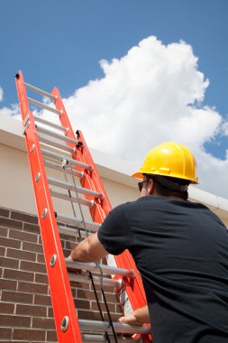 Construction Worker Climbs Ladder clipart