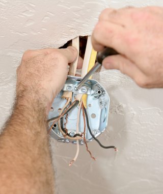 Electrician Attaching Ceiling Box clipart