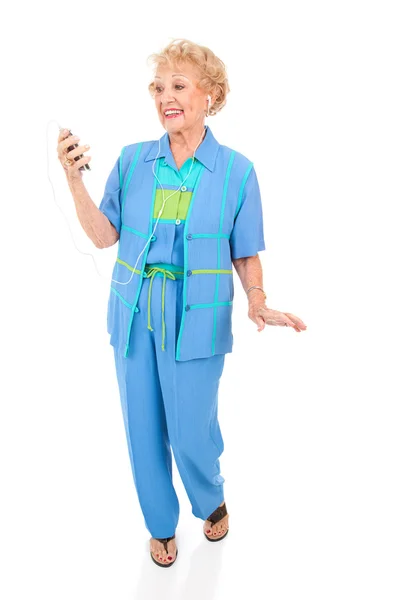 Starszy kobieta słucha mp3 gracz — Zdjęcie stockowe