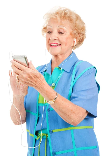 Starší žena s multimediální přehrávač — Stock fotografie