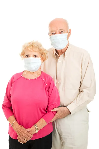 Старшая пара - Защита от гриппа — стоковое фото