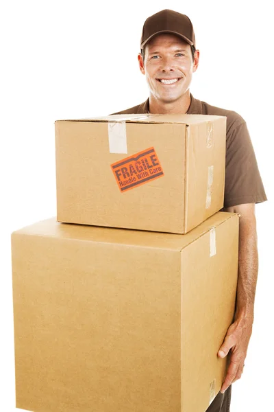 Homem de entrega com caixas pesadas — Fotografia de Stock