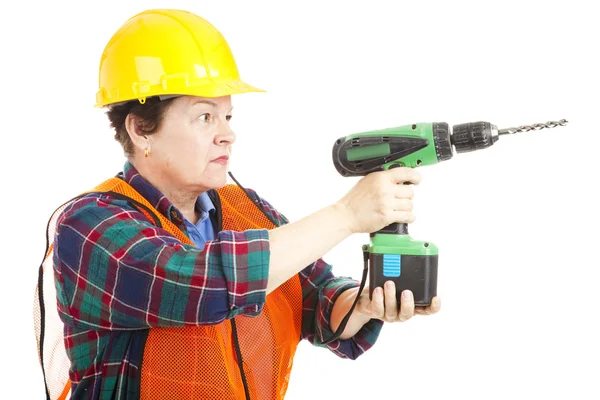 Kvinnliga byggarbetare borrning — Stockfoto