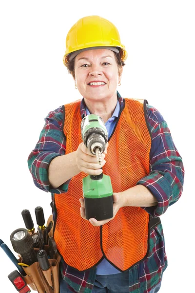 Kvinnliga byggarbetare med borr — Stockfoto