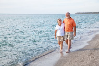 Seniors Walking on the Beach clipart