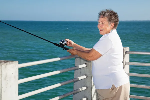 Senior Lady Fishing — Stockfoto
