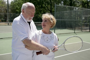 Active Seniors Play Tennis clipart