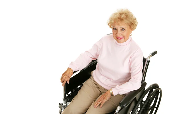 Seniorin im Rollstuhl liegend — Stockfoto