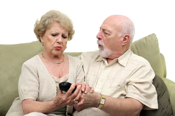 Seniors Fighting Over TV Remote — Stock Photo, Image