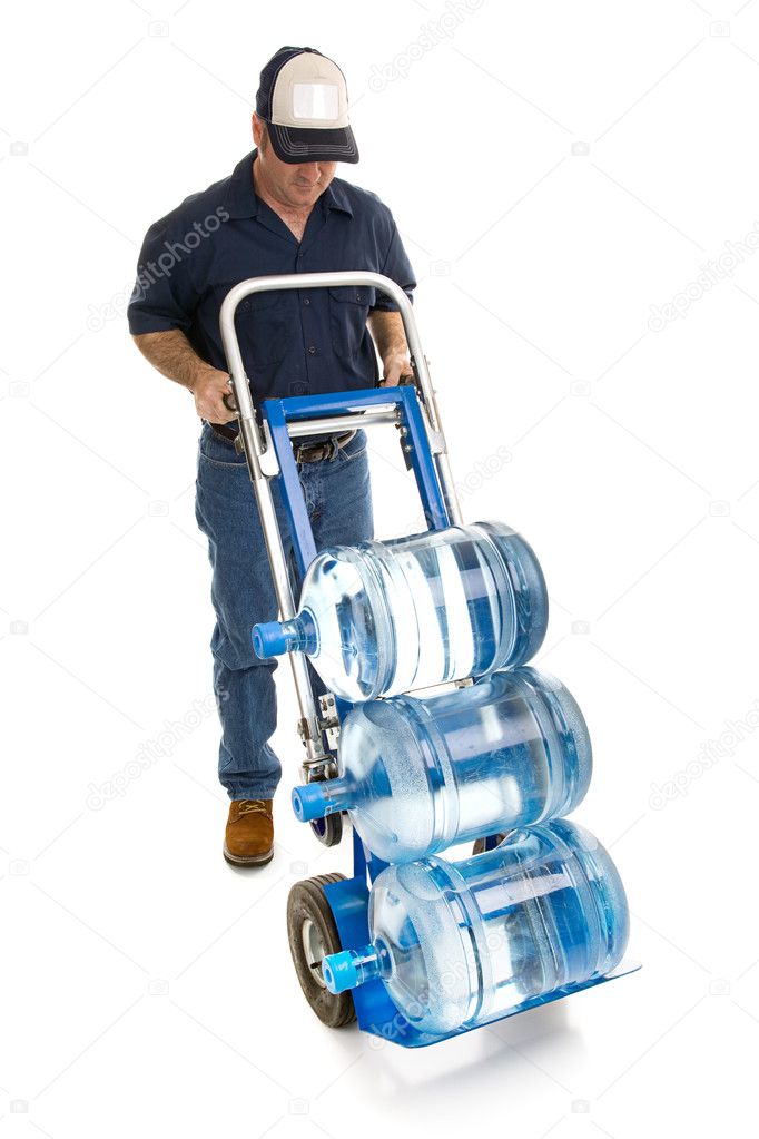 Delivery man bringing five gallon water bottles on a hand truck. Room for your logo on his hat. Full body isolated on white.