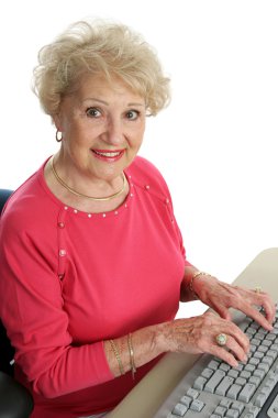 Beautiful Senior at Computer clipart