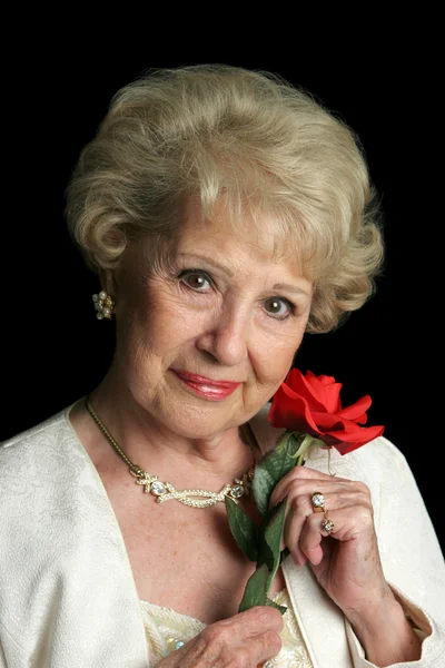 Szép vezető hölgy rózsával — Stock Fotó