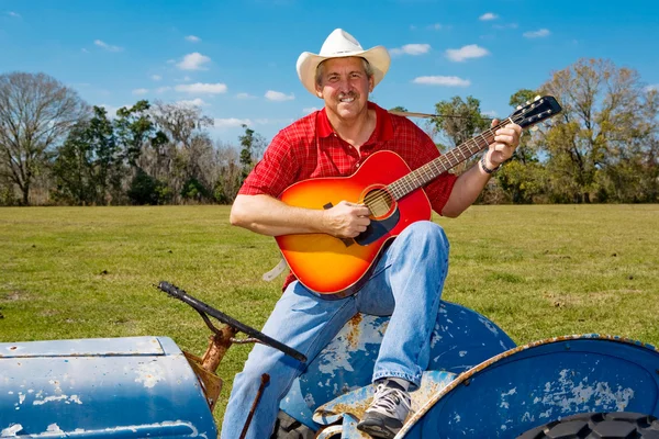 Cantando Cowboy Strums guitarra — Foto de Stock