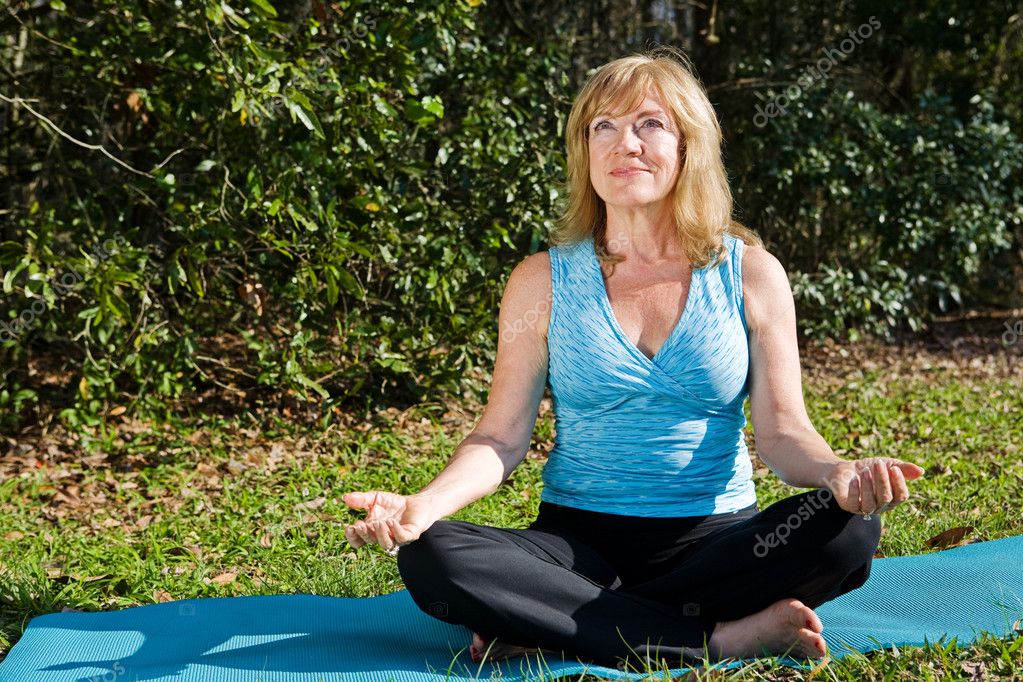 Mature Woman Yoga with Copyspace — Stock Photo © lisafx #6652407
