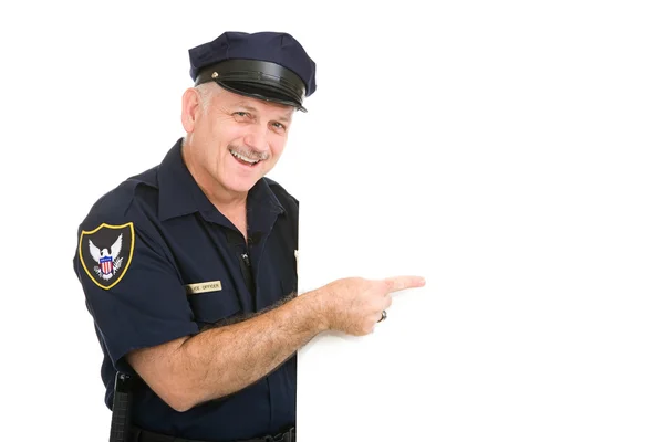 Policía feliz señalando — Foto de Stock