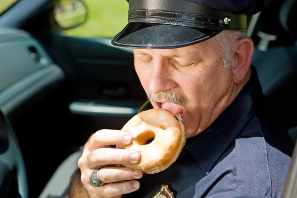 Hungry Police Officer — Stock Photo, Image