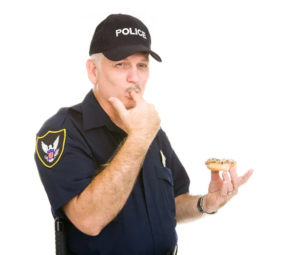 Politieagent likken vingers — Stockfoto