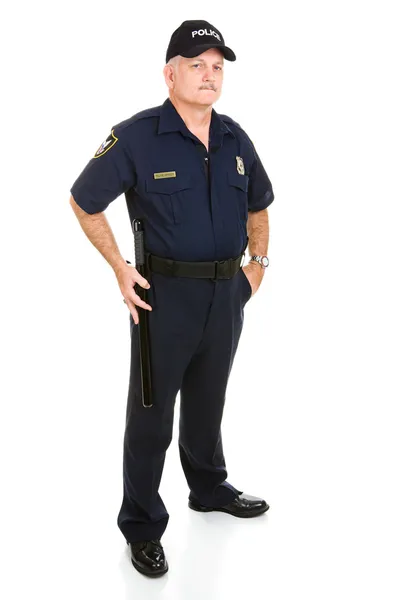 Полицейский с помощью ночной палки — стоковое фото