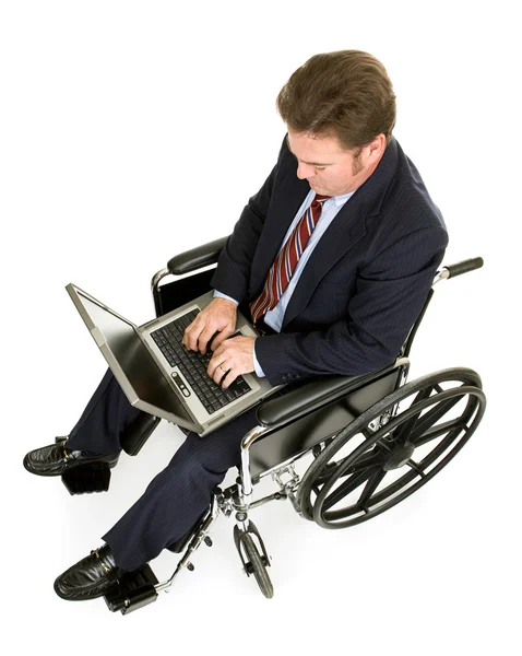Инвалид-бизнесмен с ноутбуком — стоковое фото