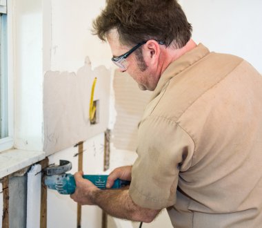 Electrician Using Grinder clipart