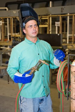 Welder on Factory Floor clipart