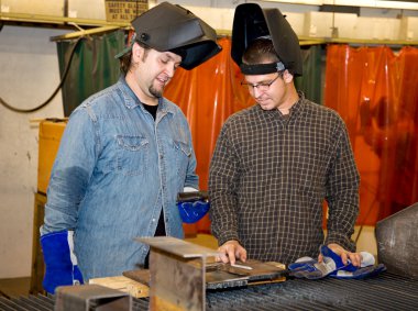 Welders Discussing the Job clipart