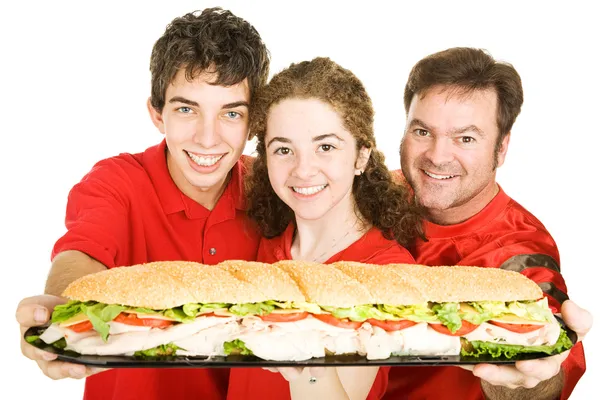 Fãs de esportes com sanduíche gigante — Fotografia de Stock