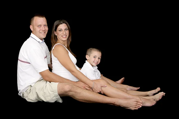 Schöne erwartungsvolle Familie — Stockfoto