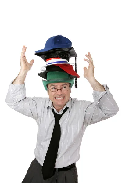Bär alltför många hattar — Stockfoto