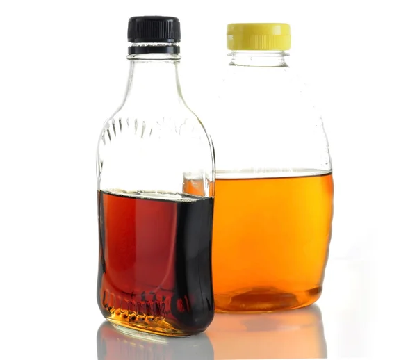 Maple syrup and honey — Stock Photo, Image