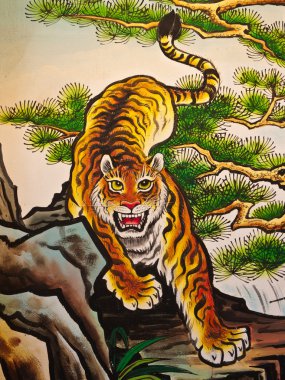 Tiger sculpture on wall clipart