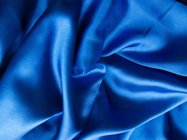 Luxusní modrý saténový pozadí — Stock fotografie