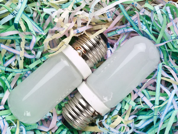 Shredded paper and bulb — Stock Photo, Image