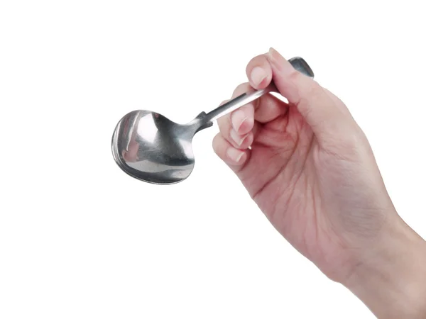 Cucchiaio in mano su sfondo bianco — Foto Stock