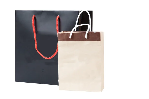 小棕包和黑色购物袋，白色的表现力上孤立 — 图库照片