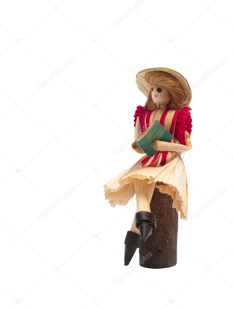 Corn husk doll isolated on white background