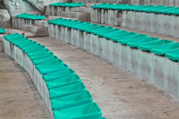 Old plastic green seats on stadium — Stock Photo, Image