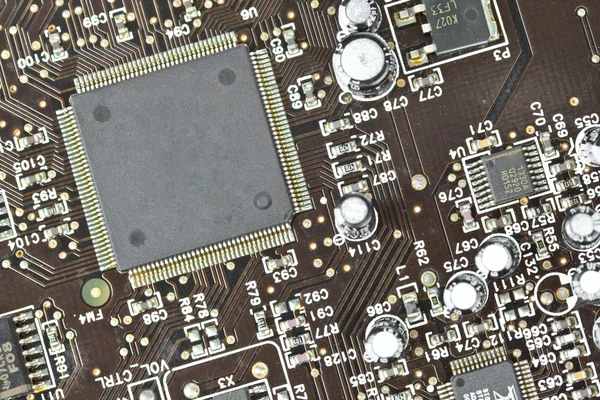 La placa de circuito impreso con componentes electrónicos macro respaldo —  Fotos de Stock