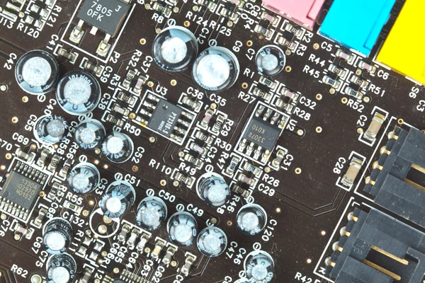 A placa de circuito impresso com componentes eletrônicos macro backg — Fotografia de Stock