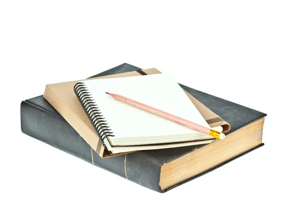 Pencil on Light cream color paper note book on brown book — Stock Photo, Image